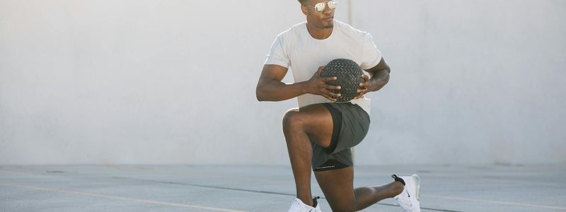 A person performing a slow, controlled lunge exercise.